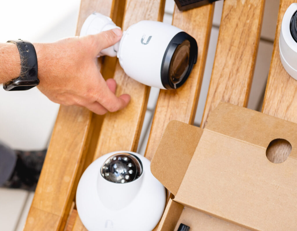 Teledata security install. Two cameras on a wooden bench.